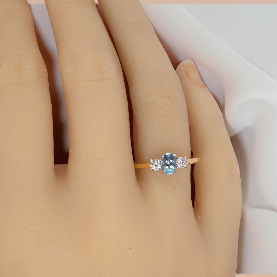 A three stone Aquamarine and Diamond ring