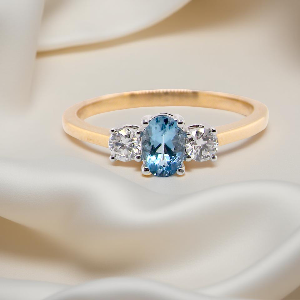 A three stone Aquamarine and Diamond ring