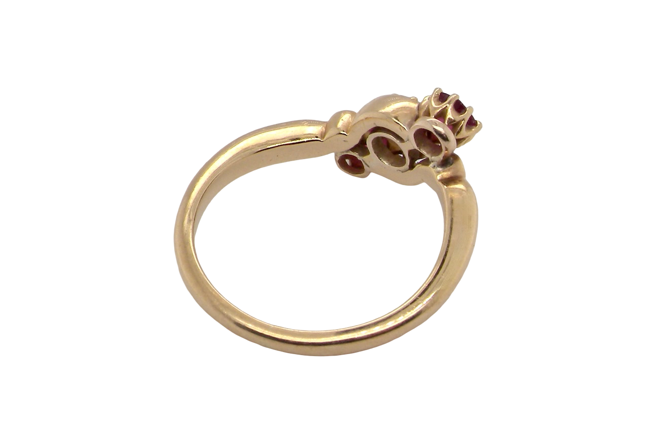 A three stone Ruby and Diamond cross over Ring