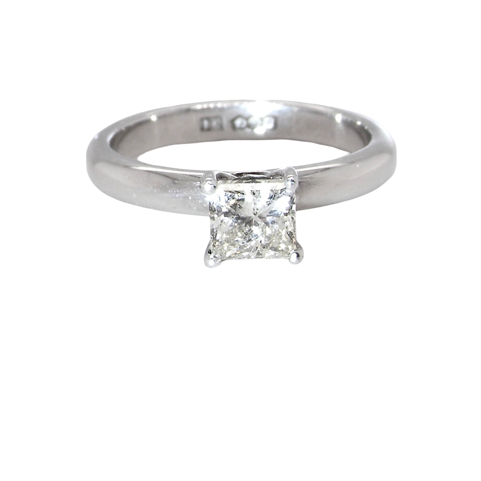 A timeless and beautifully crafted solitaire ring featuring a stunning 0.78 carat Princess-cut white diamond