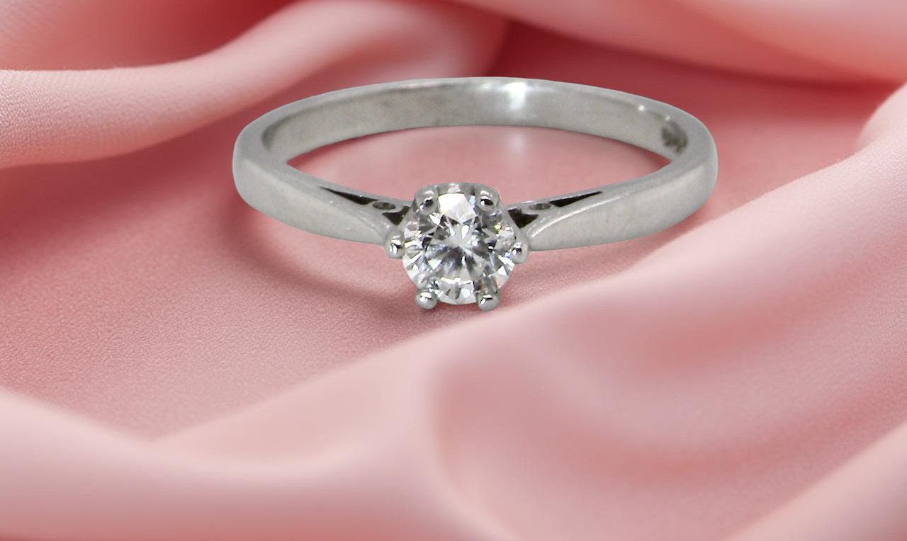 A timeless and elegant solitaire ring set with a white diamond