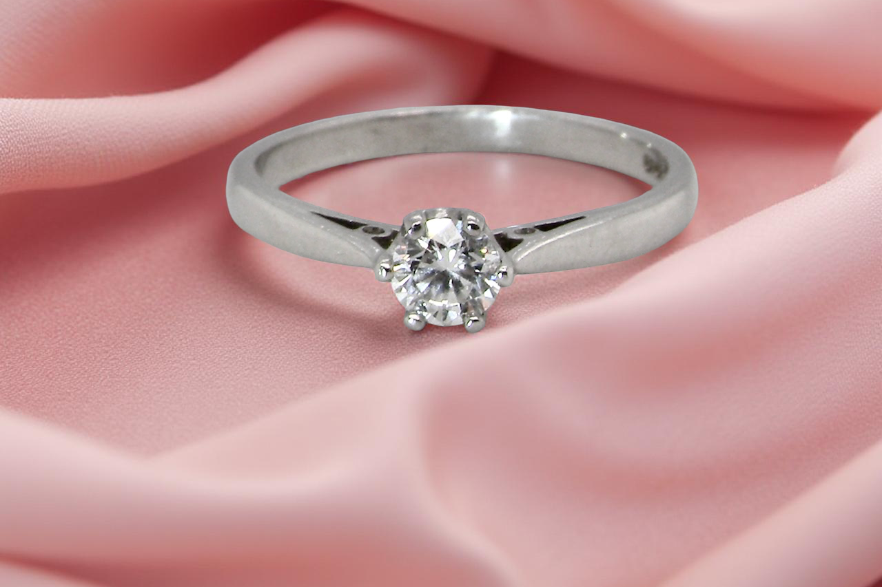 A timeless and elegant solitaire ring set with a white diamond