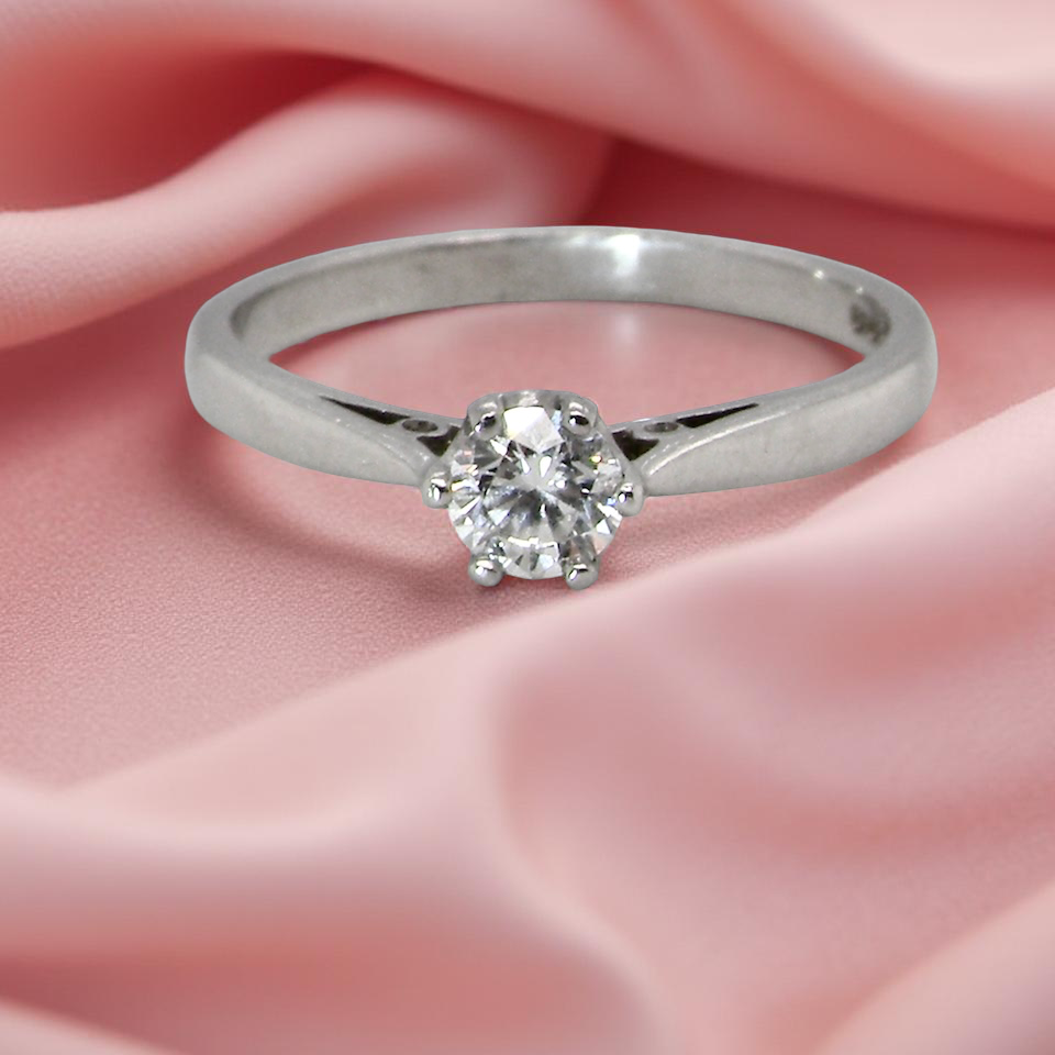 A timeless and elegant solitaire ring set with a white diamond