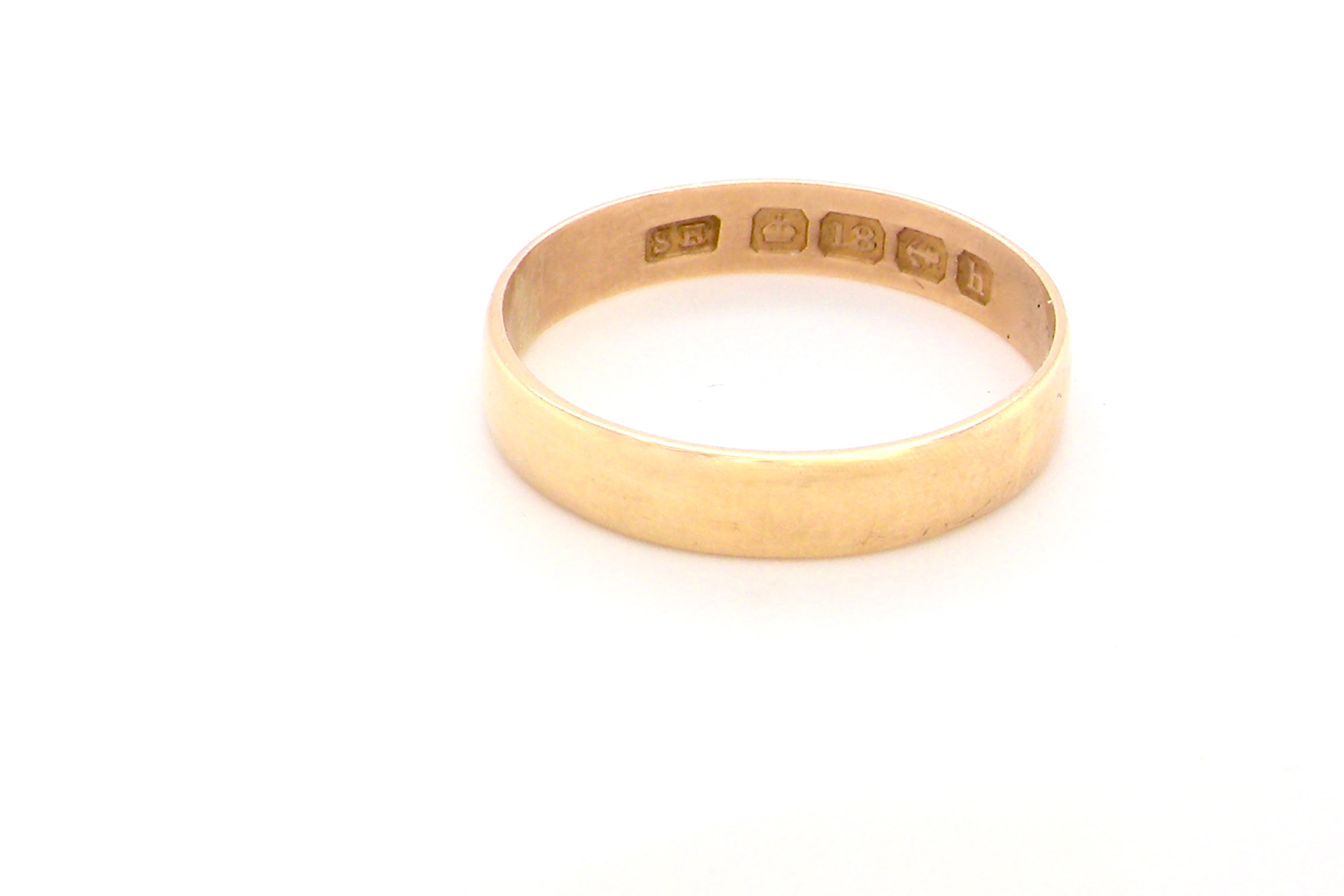 A traditional 18 carat gold wedding ring.
A flat to a slight D shape profile, width Weight 2.2grams.