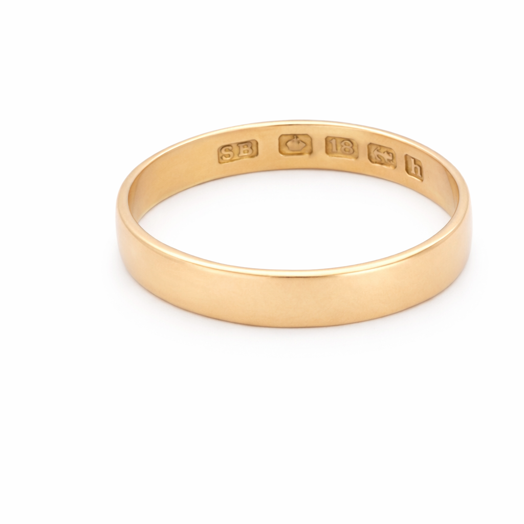 A traditional 18 carat gold wedding ring.
A flat to a slight D shape profile, width 3.6mm. Weight 2.2grams.