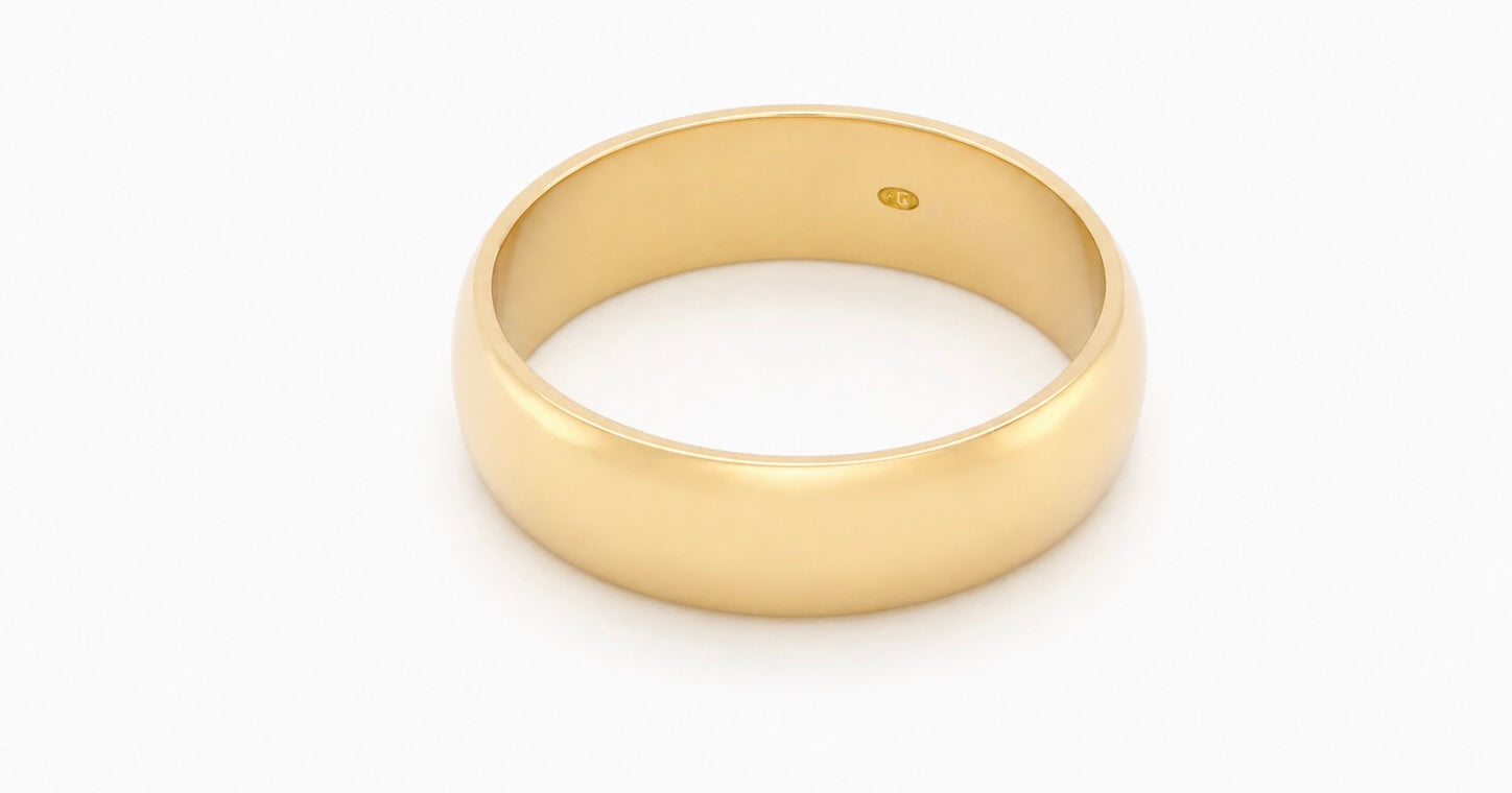 A traditional 18 carat gold wedding ring. D shape profile.
Substantial weight at 5.6grams