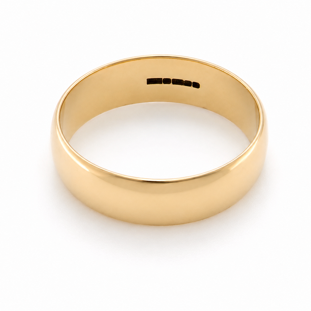 A traditional 9 carat gold wedding ring. A,