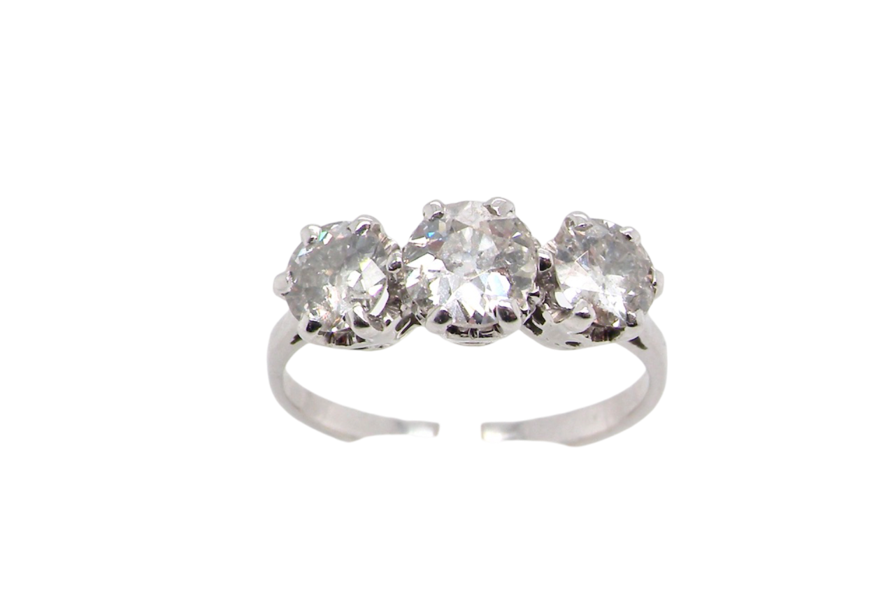a traditional 3 stone trilogy ring