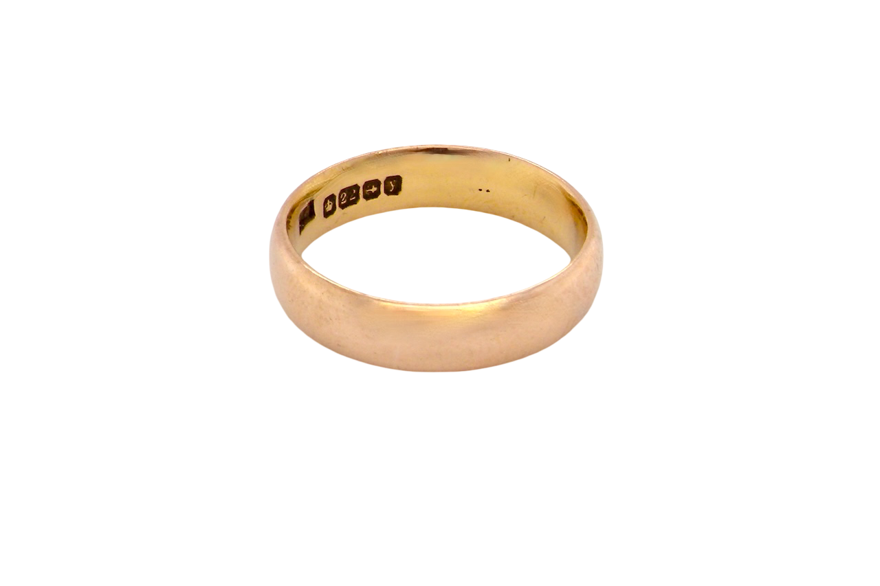 A traditional wedding ring. 22 carat gold (almost pure gold), D shape profile.
Width 4.7mm. Plain polished finish.