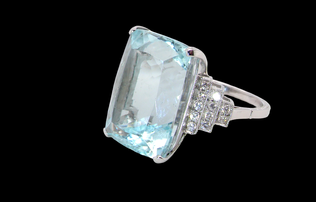A truly spectacular vintage statement ring, centred with an impressive rectangular-cut aquamarine of exceptional proportions.