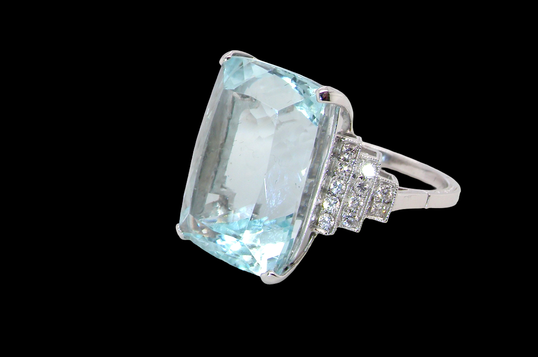 A truly spectacular vintage statement ring, centred with an impressive rectangular-cut aquamarine of exceptional proportions.