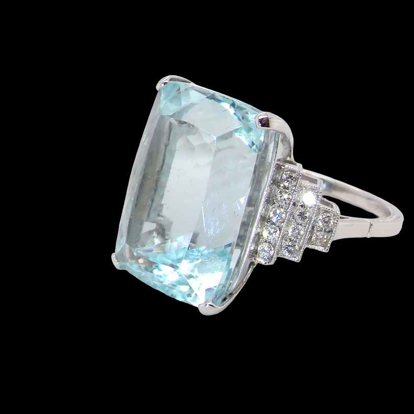 A truly spectacular vintage statement ring, centred with an impressive rectangular-cut aquamarine of exceptional proportions.