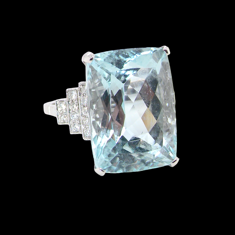 A truly spectacular vintage statement ring, centred with an impressive rectangular-cut aquamarine of exceptional proportions. Measuring approximately 18 x 13mm with a depth of 11mm, the aquamarine is estimated at 18 carats