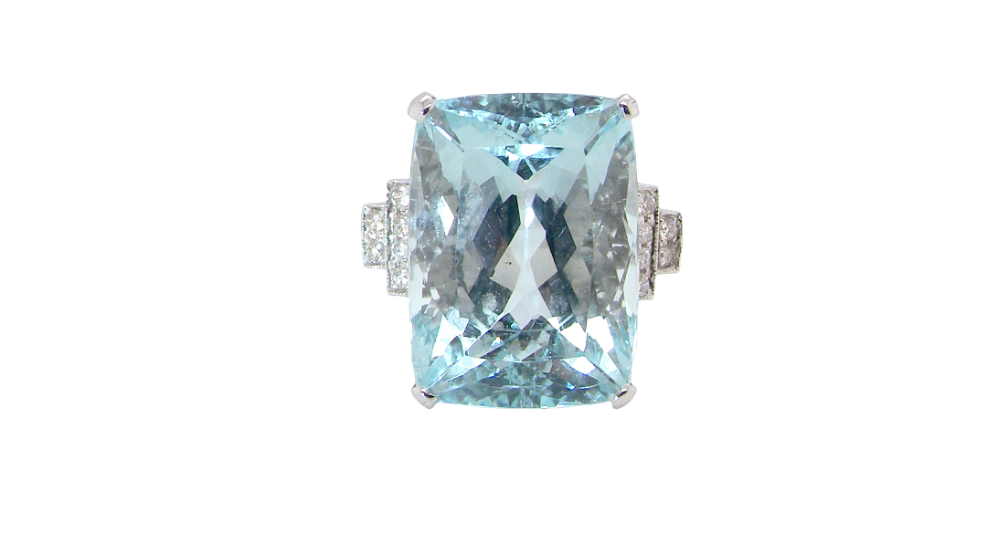 A truly spectacular vintage statement ring, centred with an impressive rectangular-cut aquamarine of exceptional proportions. Measuring approximately 18 x 13mm with a depth of 11mm, the aquamarine is estimated to weigh around 18 carats