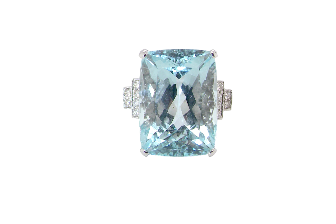 A truly spectacular vintage statement ring, centred with an impressive rectangular-cut aquamarine of exceptional proportions. Measuring approximately 18 x 13mm with a depth of 11mm, the aquamarine is estimated to weigh around 18 carats