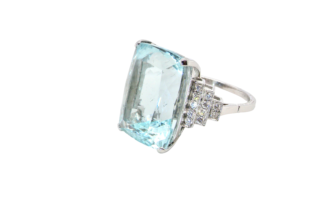 A truly spectacular vintage statement ring, centred with an impressive rectangular-cut aquamarine of exceptional proportions. Measuring approximately 18 x 13mm with a depth of 11mm, the aquamarine is estimated to weigh around 18 carats side