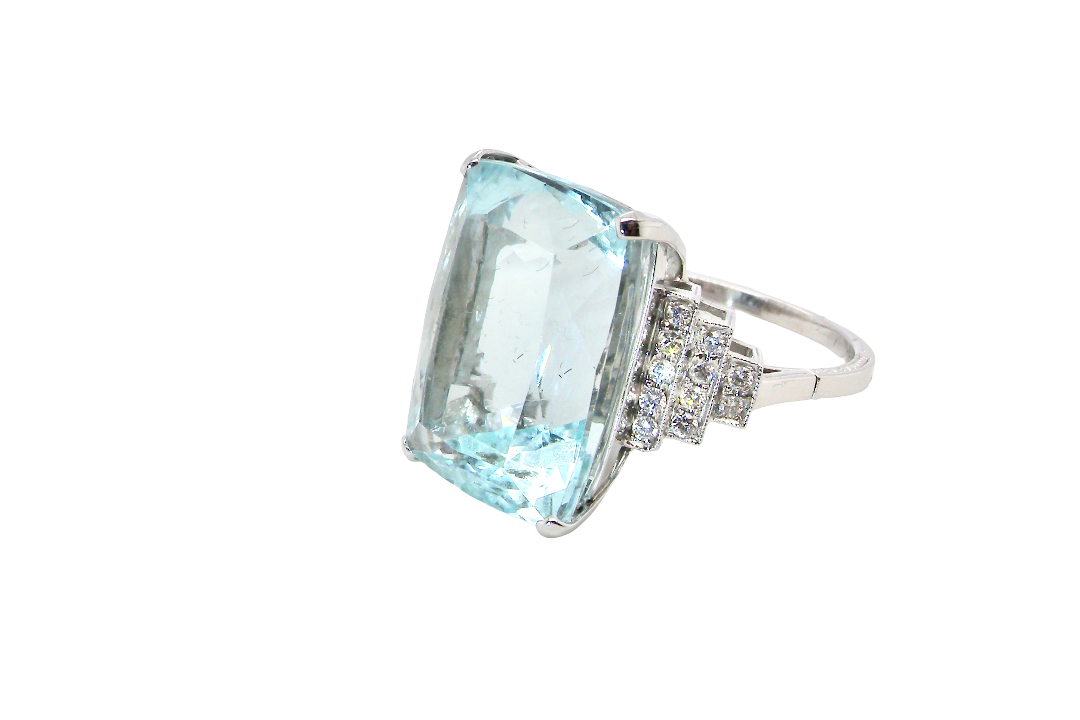 A truly spectacular vintage statement ring, centred with an impressive rectangular-cut aquamarine of exceptional proportions. Measuring approximately 18 x 13mm with a depth of 11mm, the aquamarine is estimated to weigh around 18 carats side