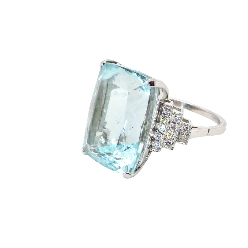 A truly spectacular vintage statement ring, centred with an impressive rectangular-cut aquamarine of exceptional proportions. Measuring approximately 18 x 13mm with a depth of 11mm, the aquamarine is estimated to weigh around 18 carats side