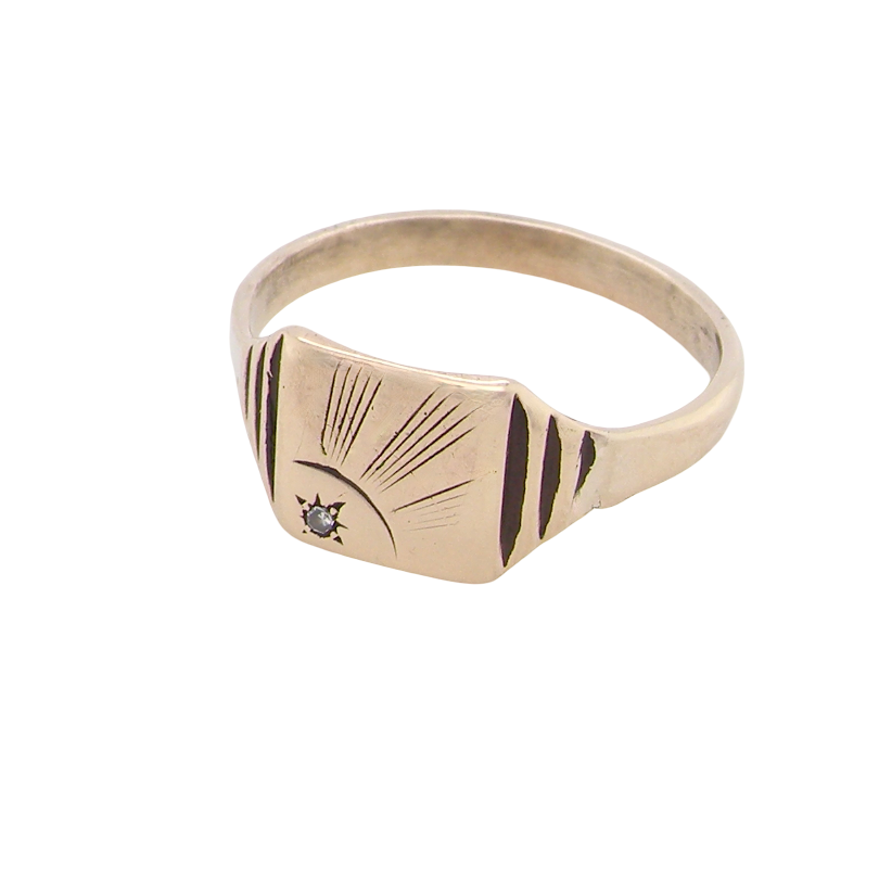 A unisex signet ring. Square head measures 8.5x8.5mm, sunray pattern and set with a 1mm diamond.