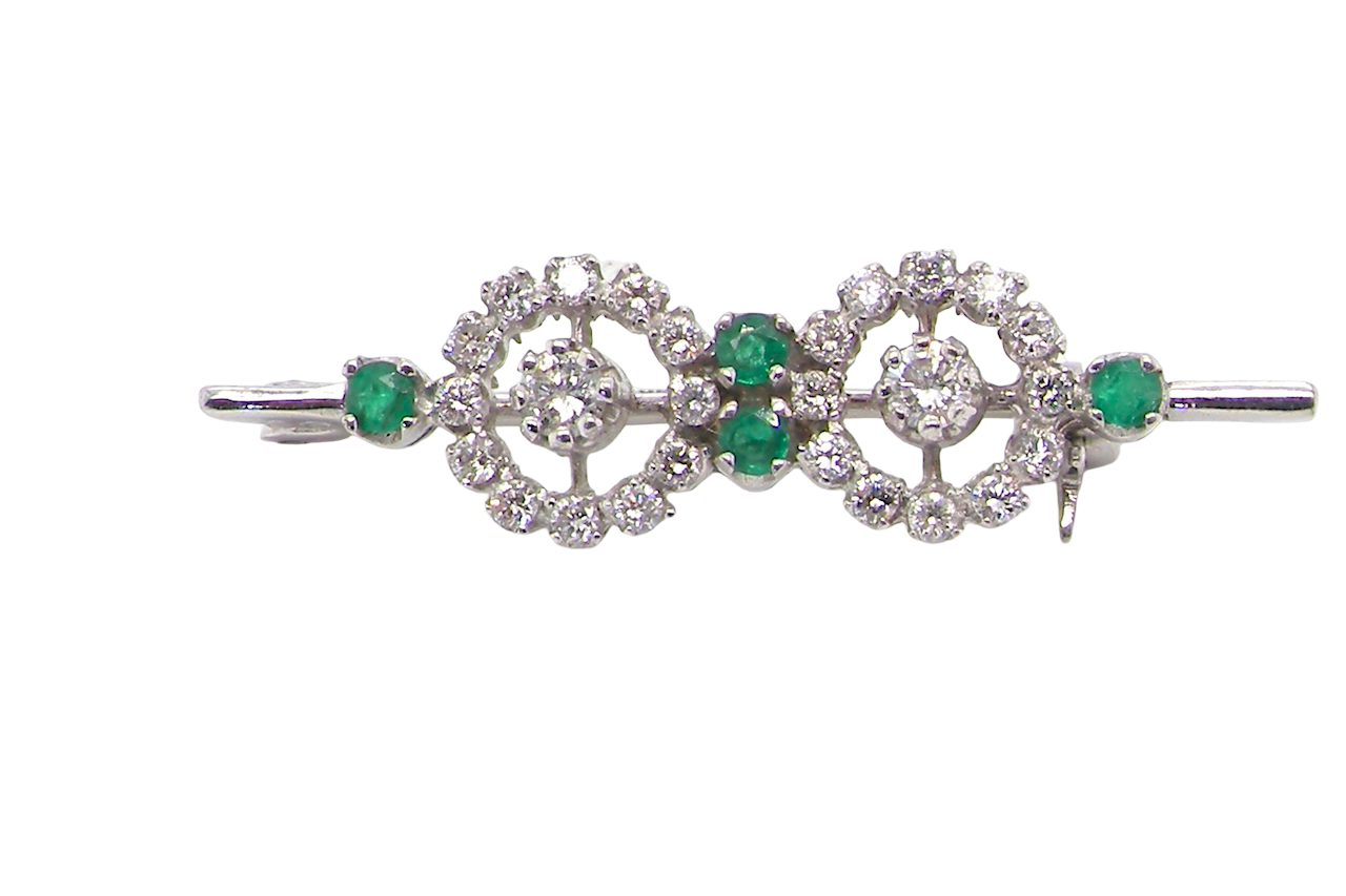 A very pretty and wearable brooch. A double cluster of brilliant cut white diamonds, each set to the centre with an 0.10 carat stone and surrounded by twelve x 0.015 carat stones*. 