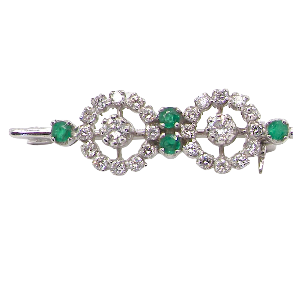 A very pretty and wearable brooch. A double cluster of brilliant cut white diamonds, each set to the centre with an 0.10 carat stone and surrounded by twelve x 0.015 carat stones*. 