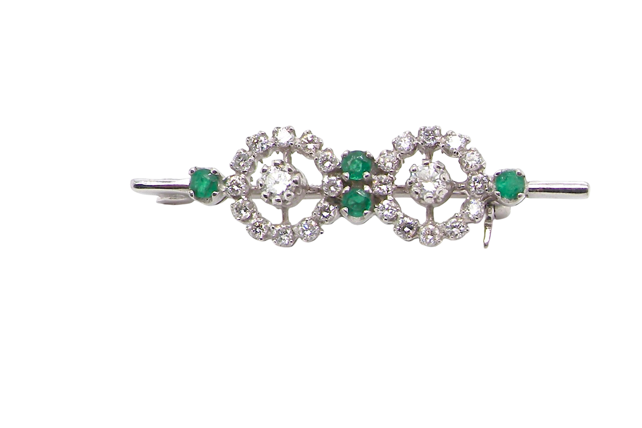A very pretty and wearable brooch. A double cluster of brilliant cut white diamonds, each set to the centre with an 0.10 carat stone and surrounded by twelve x 0.015 carat stones*. Total carat weight estimated at 0.60 carats*