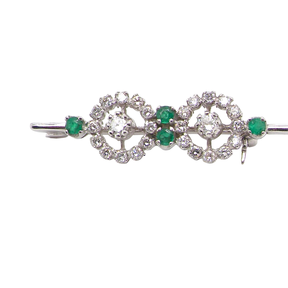 A very pretty and wearable brooch. A double cluster of brilliant cut white diamonds, each set to the centre with an 0.10 carat stone and surrounded by twelve x 0.015 carat stones*. Total carat weight estimated at 0.60 carats*