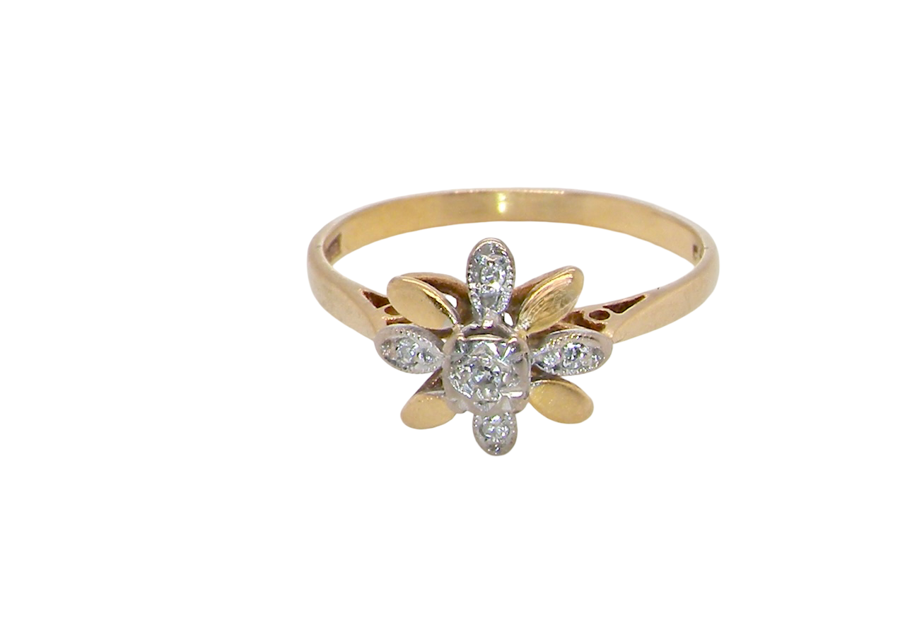 A very pretty cluster ring, a design from the 1950s. Its daisy style was popular during this period, and set with five small white diamonds (total est. 0.05 carats) set into platinum.