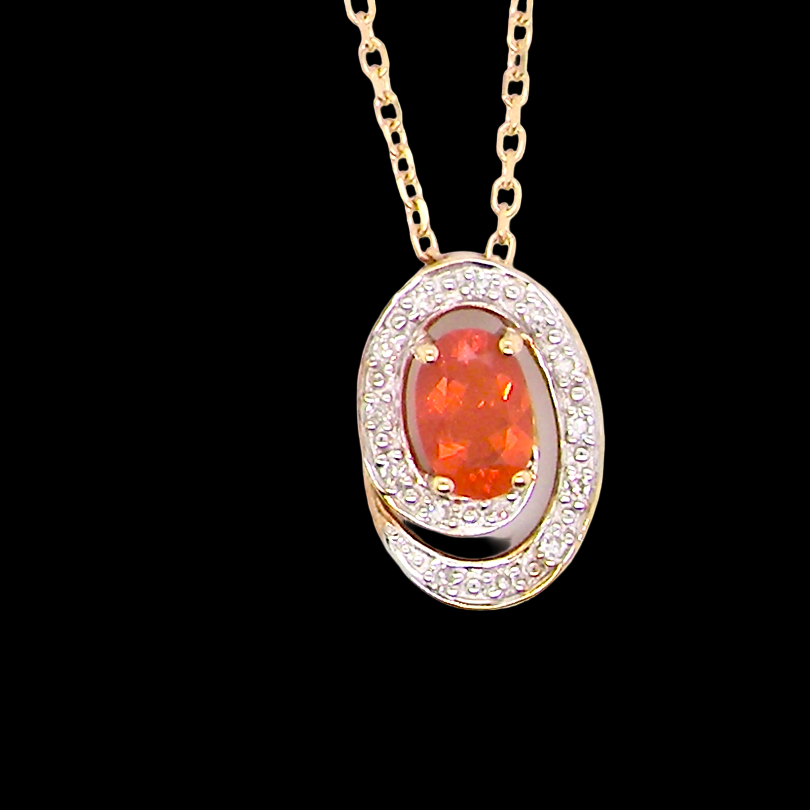 A very pretty pendant set with a fireglow orange Fire Opal. 