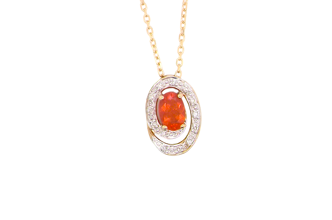 A very pretty pendant set with a fireglow orange Fire Opal. Measures 6x4mm