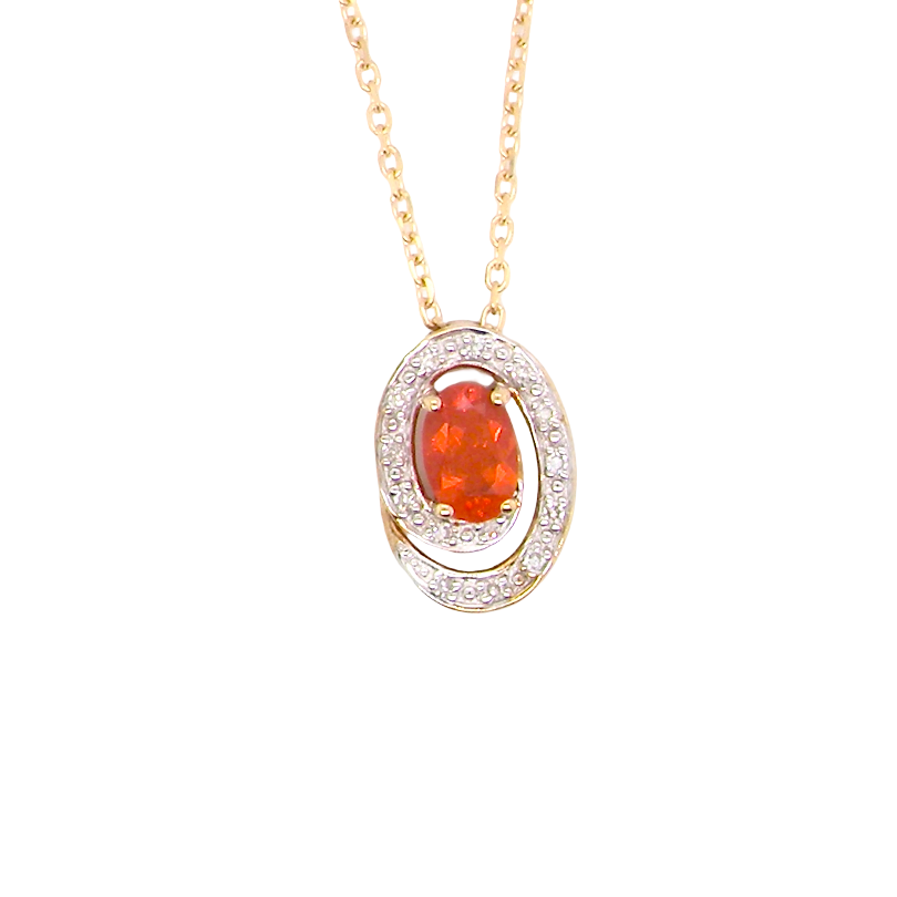 A very pretty pendant set with a fireglow orange Fire Opal. Measures 6x4mm