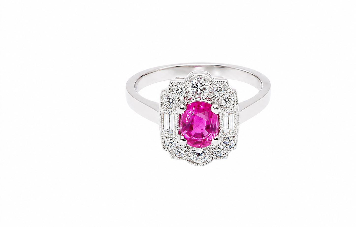 A very pretty ring that features an oval cut pink sapphire, 6x4mm (est 0.50 carats). 