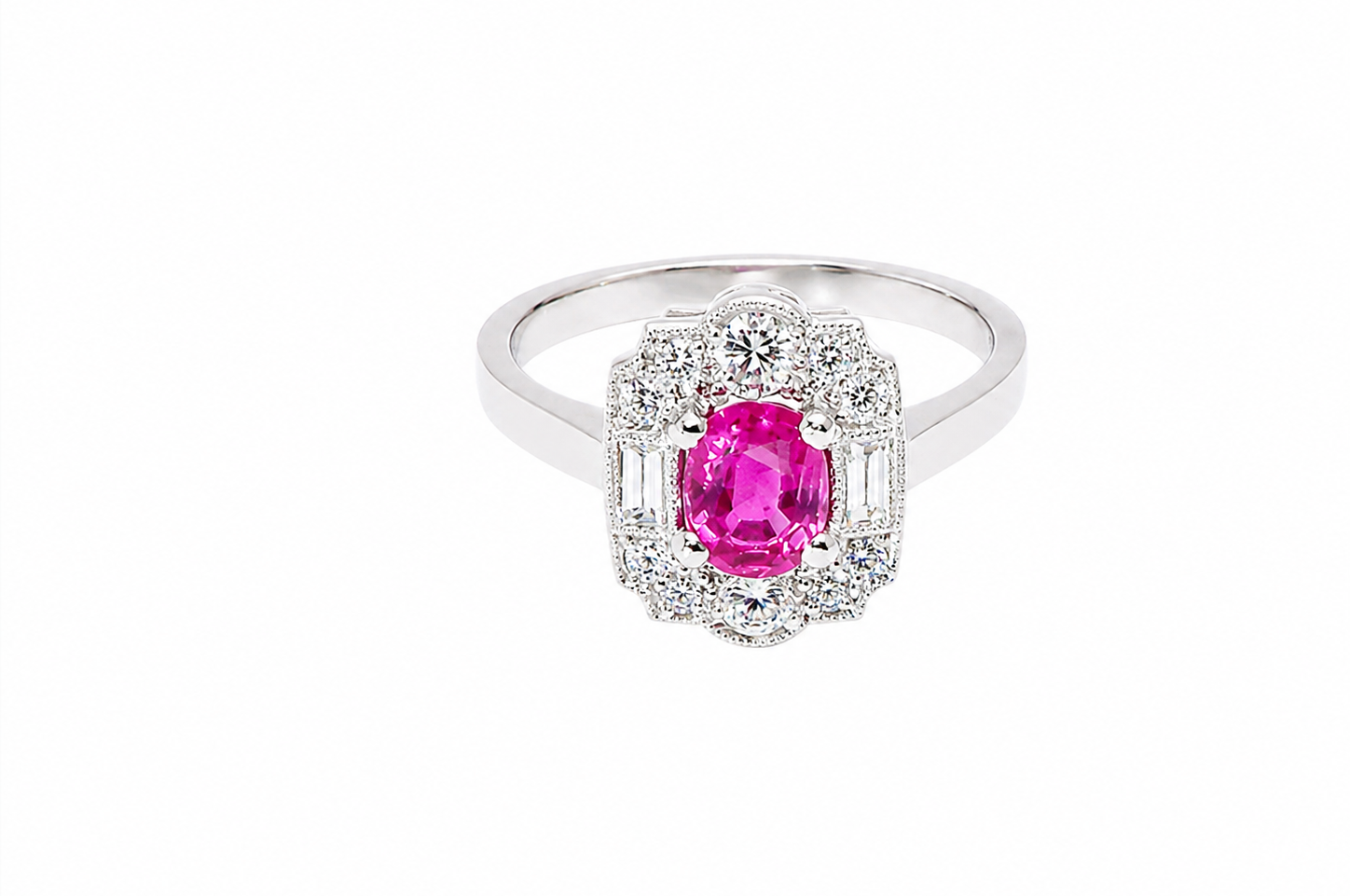 A very pretty ring that features an oval cut pink sapphire, 6x4mm (est 0.50 carats). 