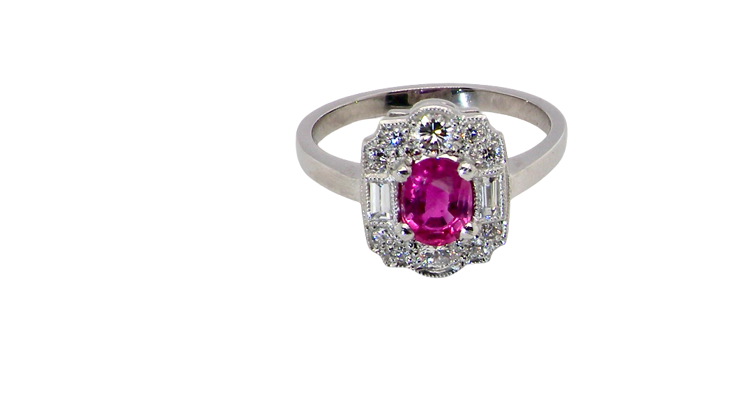 A very pretty ring that features an oval cut pink sapphire, 6x4mm 