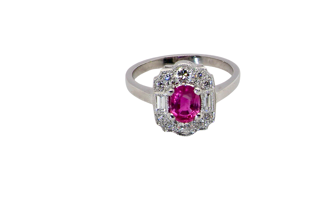 A very pretty ring that features an oval cut pink sapphire, 6x4mm 