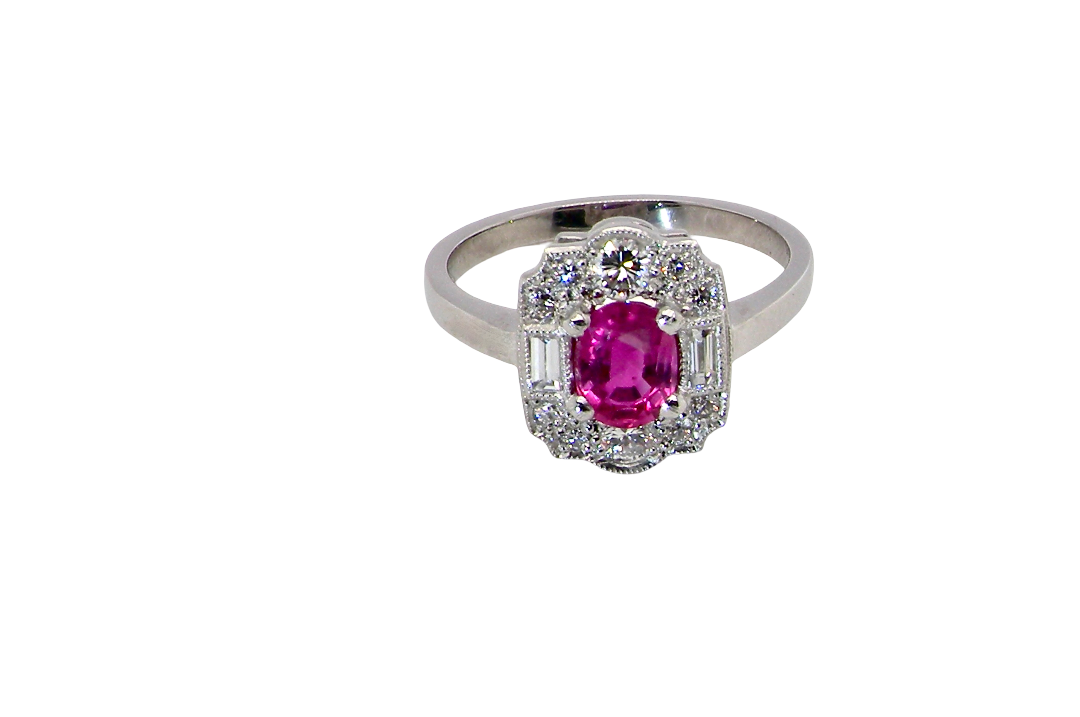 A very pretty ring that features an oval cut pink sapphire, 6x4mm 