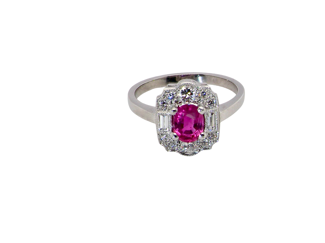 A very pretty ring that features an oval cut pink sapphire, 6x4mm 
