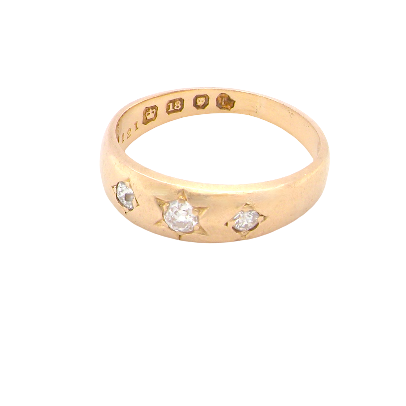 A vintage 18 carat gold three stone ring. Set with brilliant cut white diamonds, cente 3mm, each side a 2.4mm diamond (total est 0.20 carats) Colour I-j, clarity Si. 