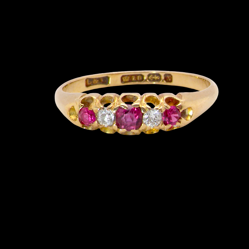 A vintage 18 carat gold three stone ring. Set with brilliant cut white diamonds, cente 3mm, each side a 2.4mm diamond (total est 0.20 carats) Colour I-j, clarity Si.
A