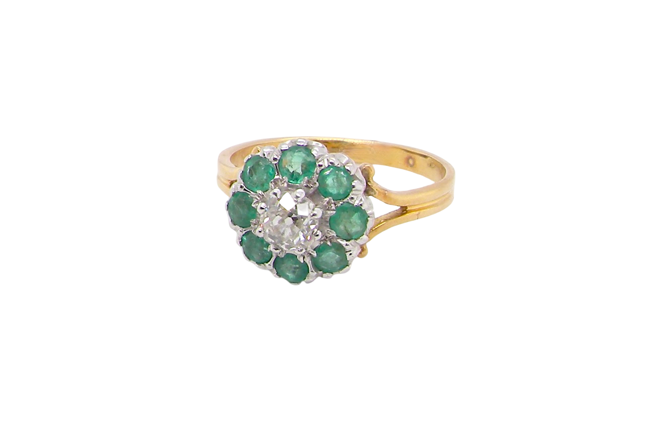 A vintage 1960s cluster ring. Principal stone a brilliant cut white diamond, 0.45 carats