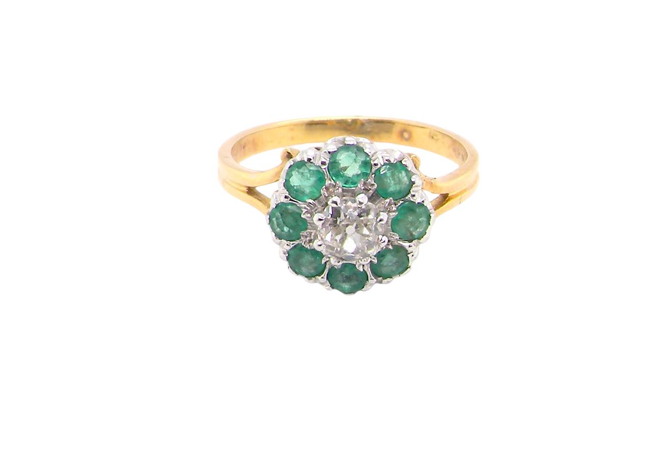 A vintage 1960s cluster ring. Principal stone a brilliant cut white diamond, 0.45 carats () 