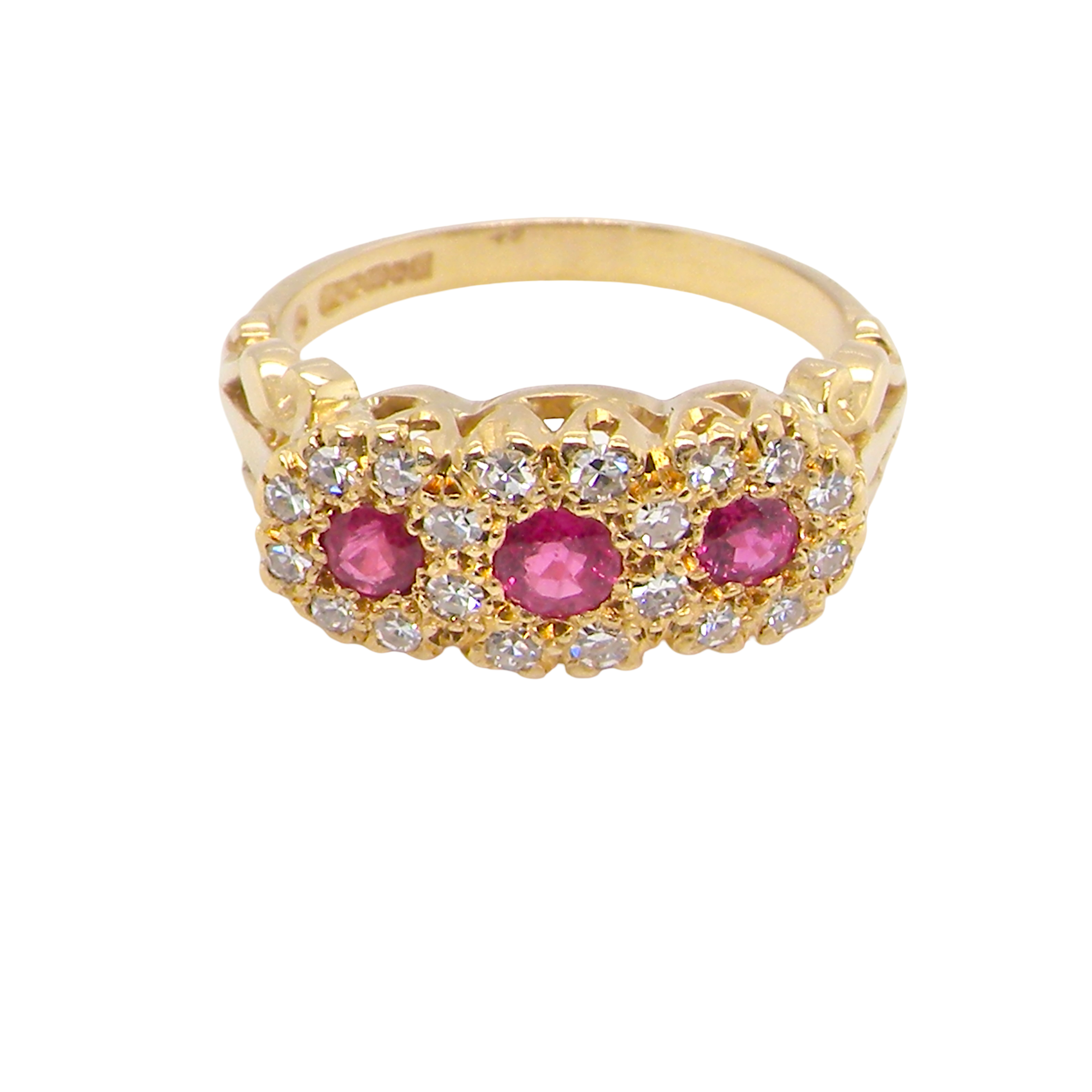 Gold ring with pink gemstones and diamonds on a white background