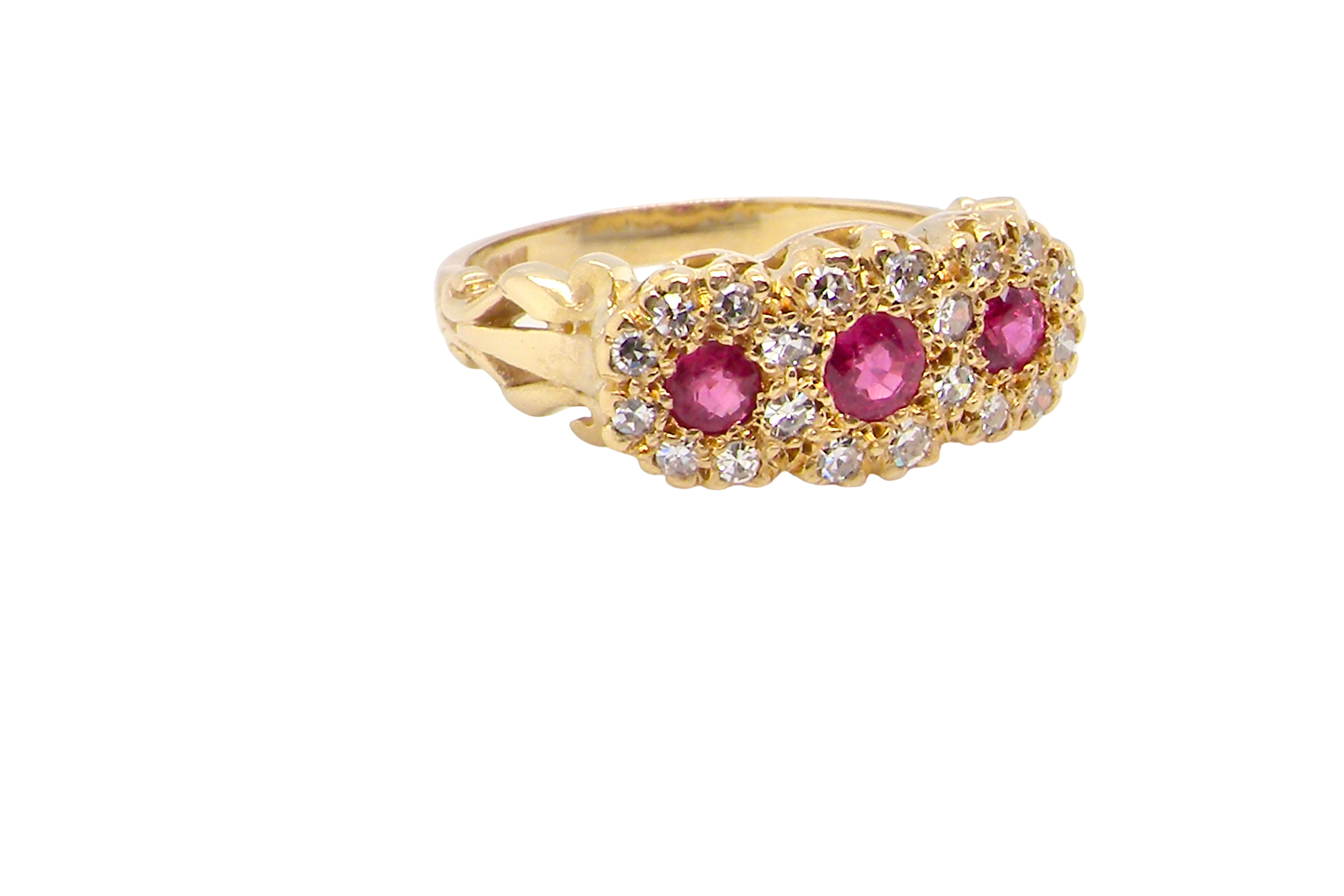 Gold ring with pink gemstones on a white background
