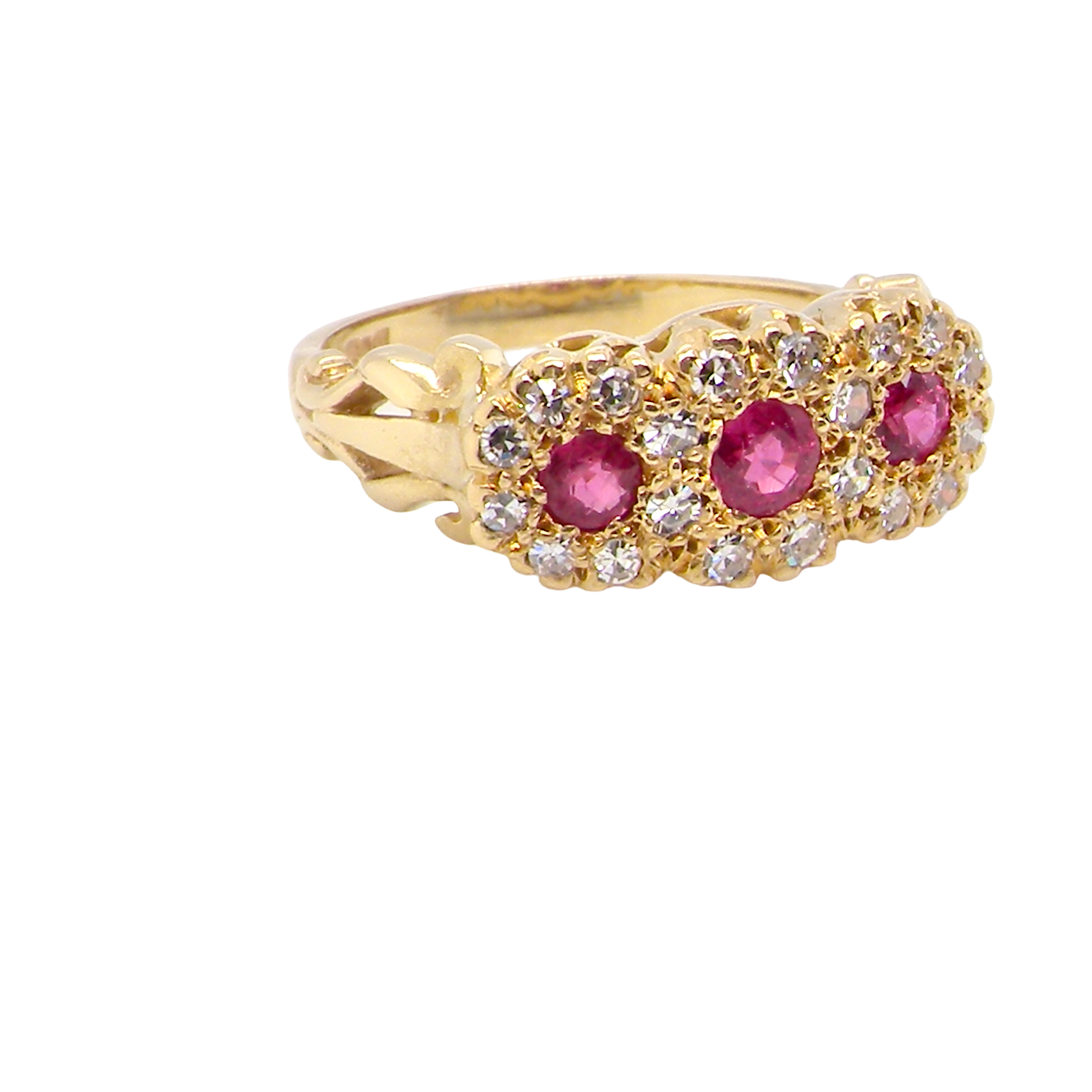 Gold ring with pink gemstones on a white background
