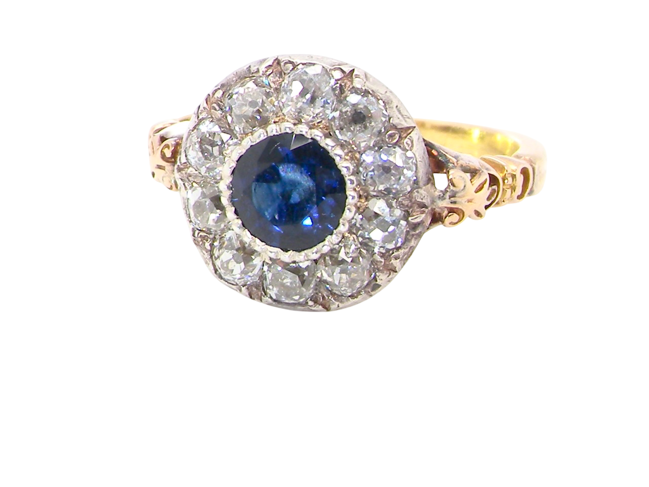 cl;ose up A vintage Sapphire and Diamond cluster ring early 20th century