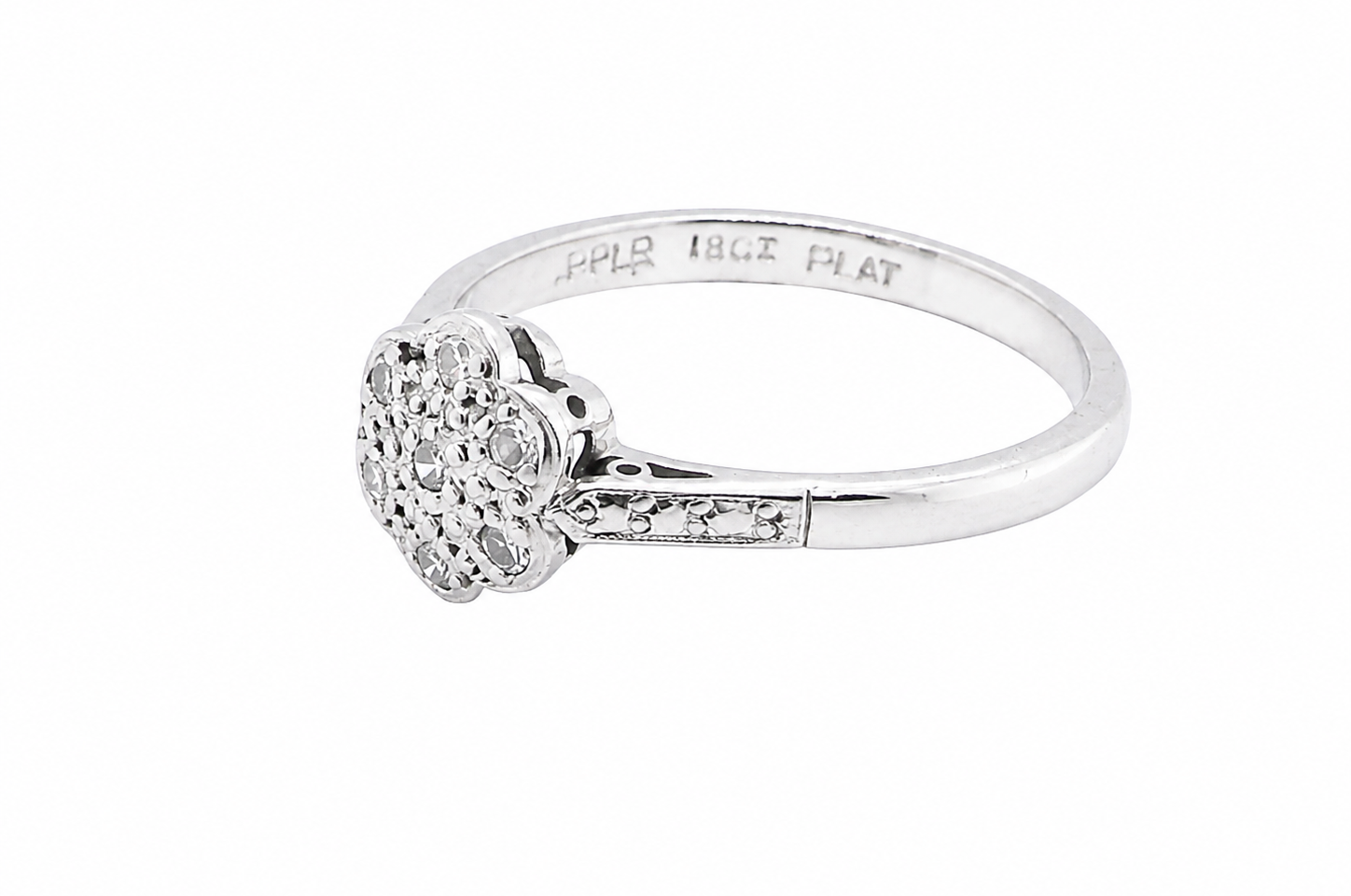 A vintage cluster ring, the head set with seven small single cut white diamonds, (est 0.15 carats)