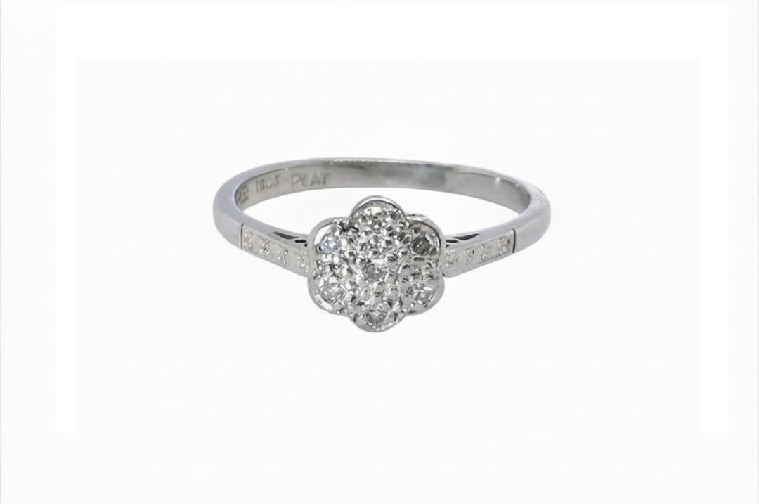 A vintage white gold diamond cluster ring