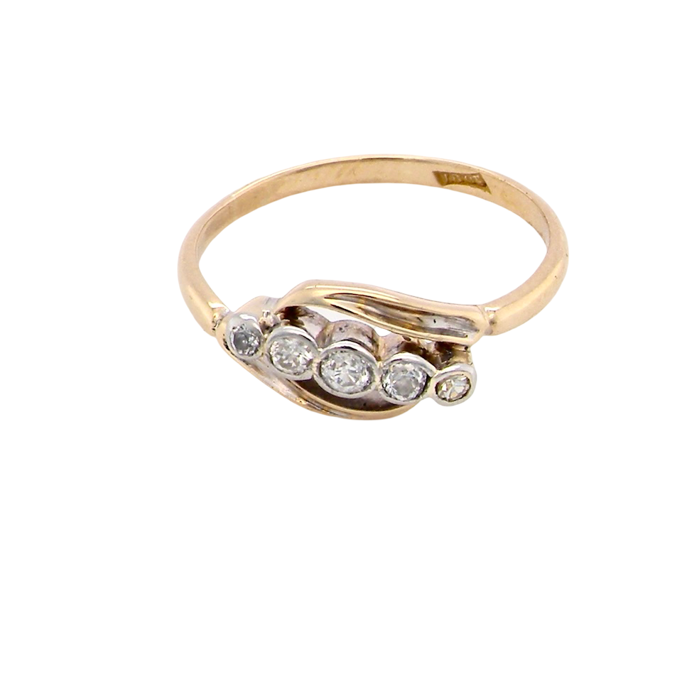 A vintage cross over style ring. Set with five old brilliant cut white diamonds. Centre stone 3mm, each side 2.4mm, each end 1.5mm. Total diamond content estimated at 0.22 carats.