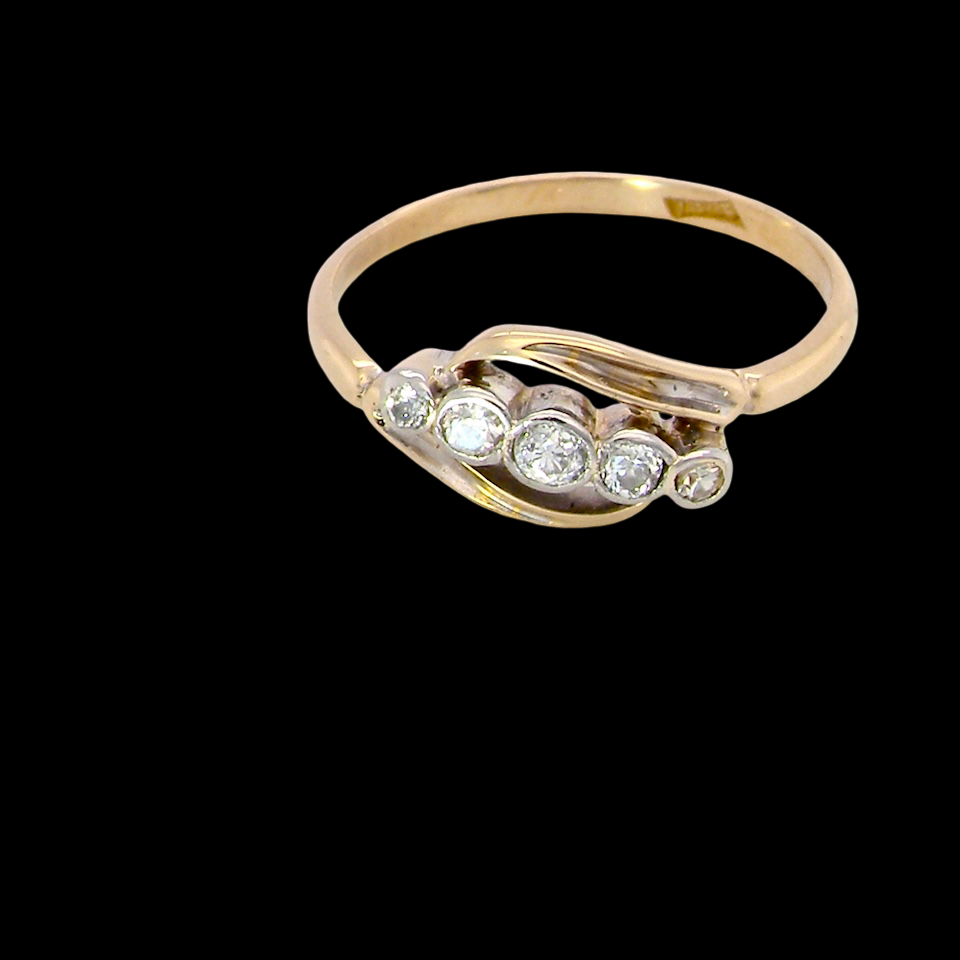 A vintage cross over style ring. Set with five old brilliant cut white diamonds. Centre stone 3mm, each side 2.4mm, each end 1.5mm. Total diamonds at 0.22 carats.