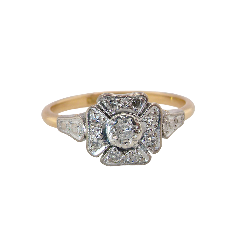 A vintage diamond cluster ring. Shaped like a four leaf clover, each leaf is pavé set with small white diamonds, two each x 1.5mm. Centre diamond 2.4mm.